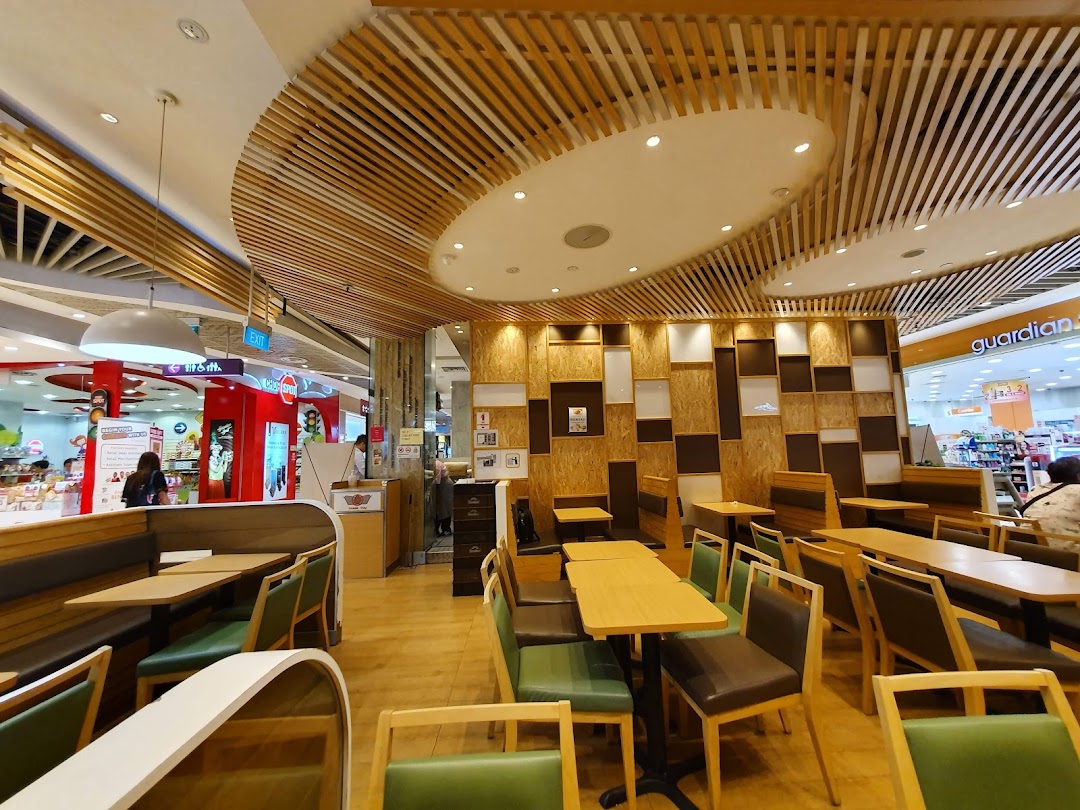 Interior view of a restaurant with tables, chairs, and booths.