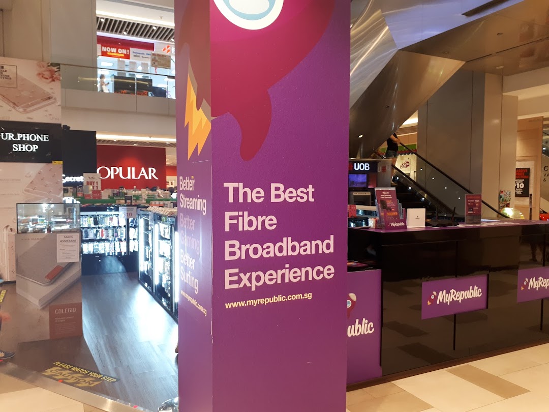Interior view of a MyRepublic kiosk and large promotional pillar in a mall.