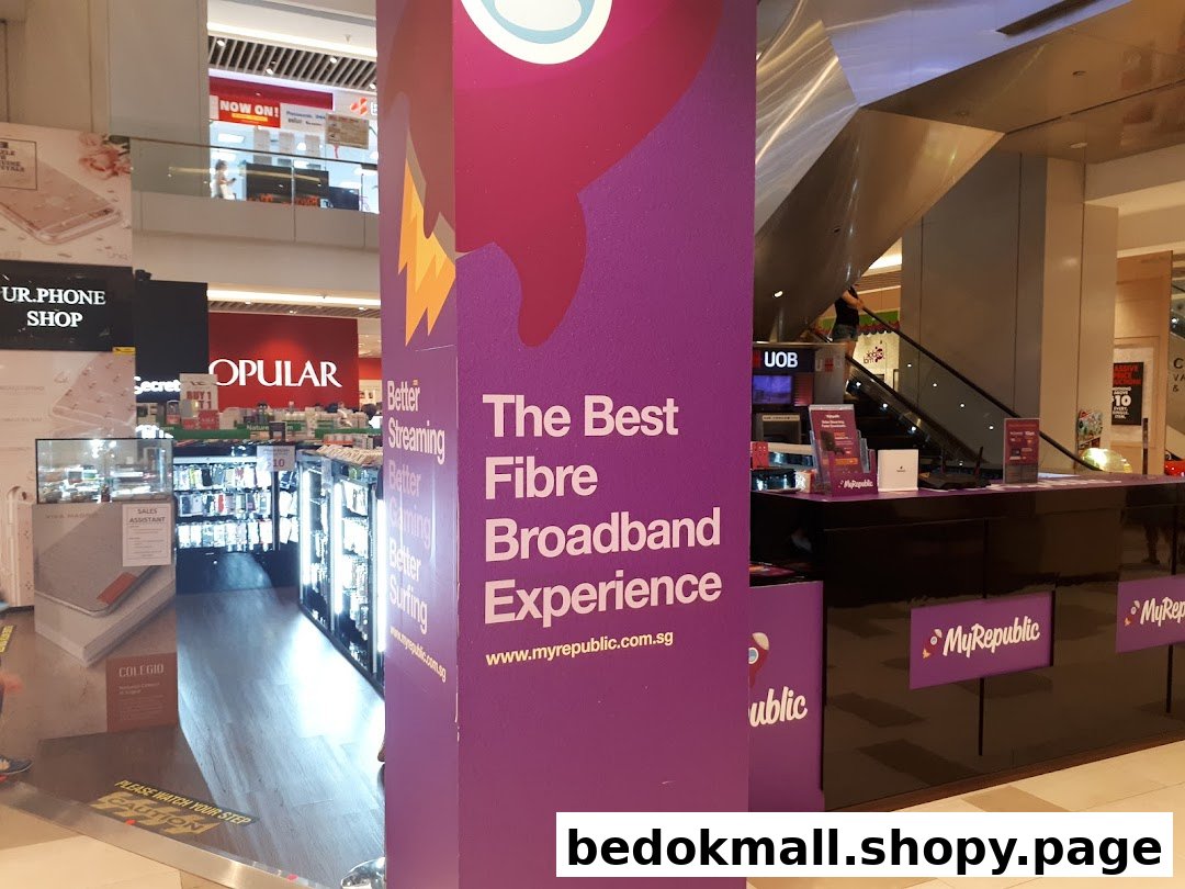 Interior view of a MyRepublic kiosk and large promotional pillar in a mall.