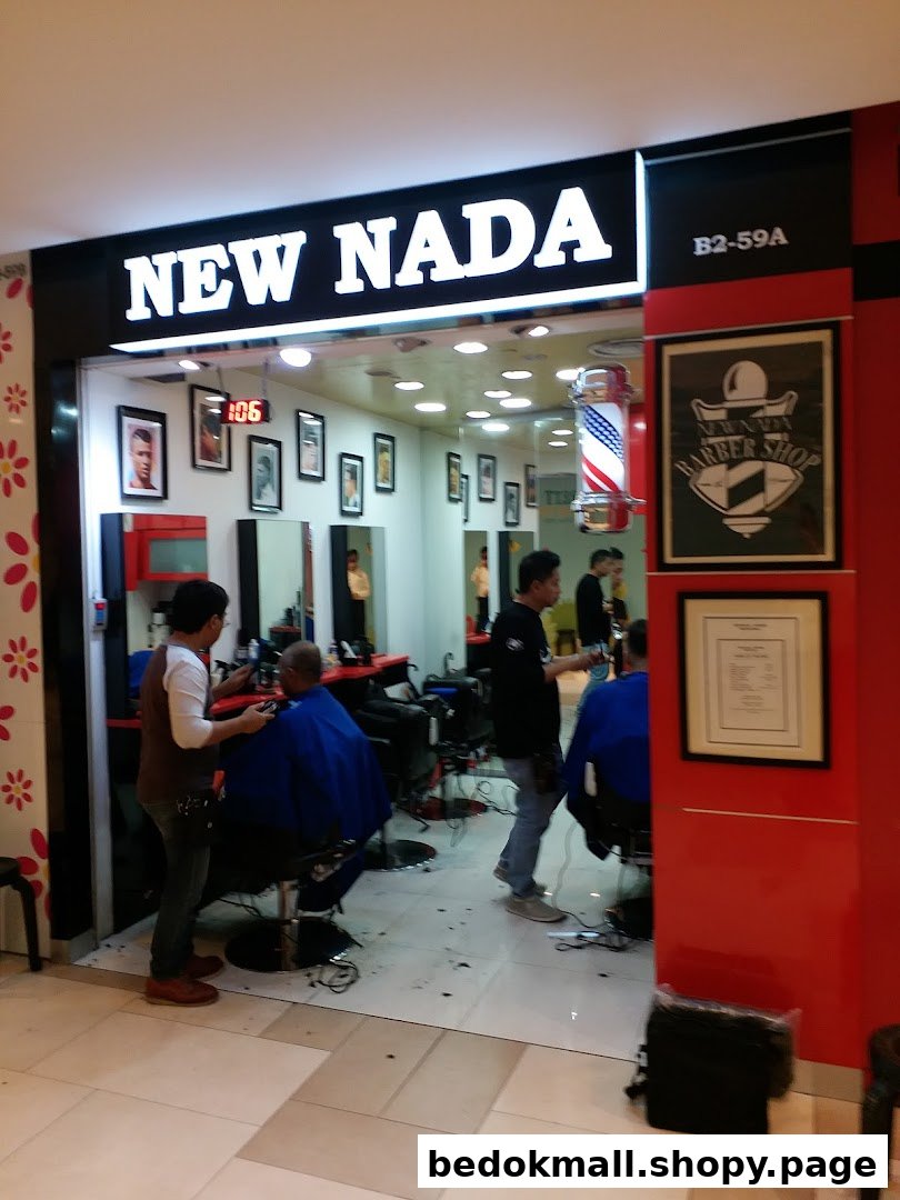 Shop front of New Nada Barber with barbers and customers inside.