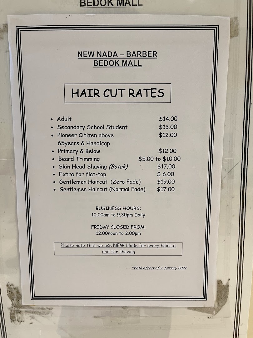 A price list for haircut rates and business hours at New Nada Barber.