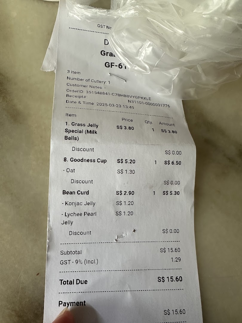 A close-up of a retail receipt showing dessert items, prices, and total due.
