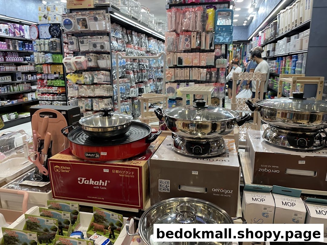Interior view of a retail shop displaying kitchenware and various household items.