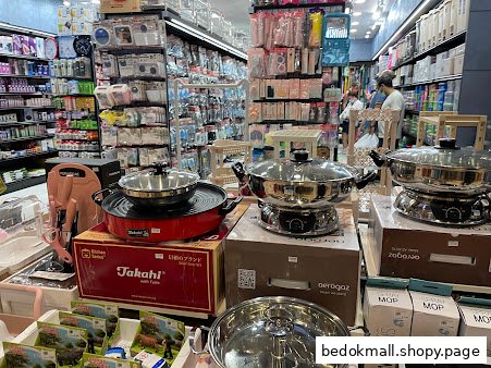 Interior view of a retail store displaying kitchenware and various household products.
