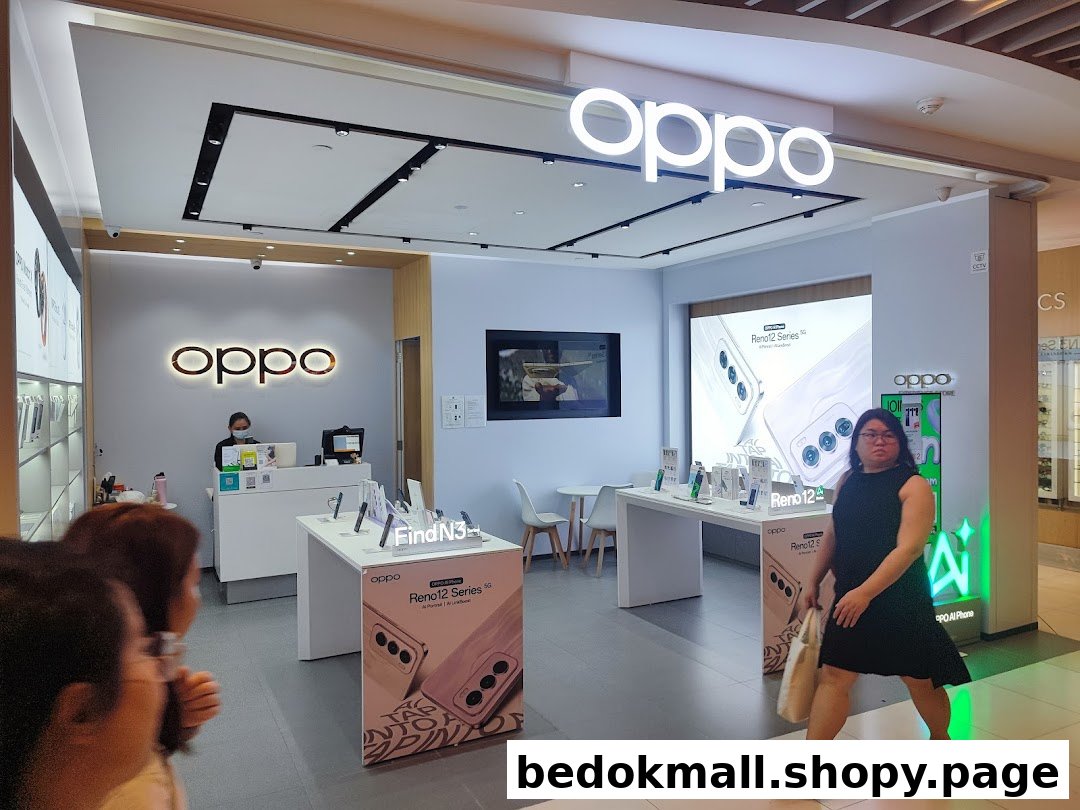Interior view of an OPPO store with display tables and staff.