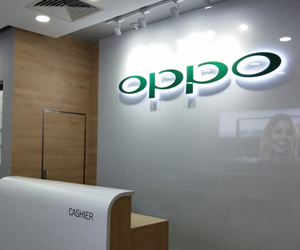 Interior view of an OPPO store with a cashier desk and logo.