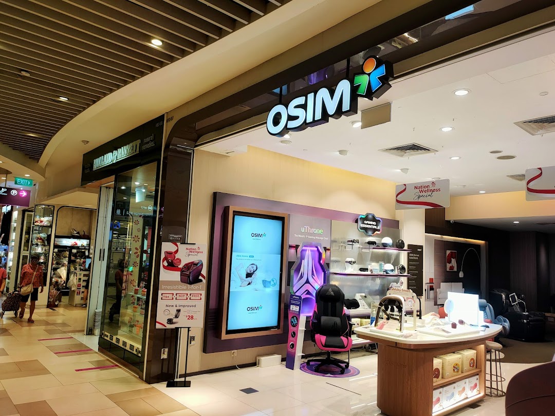 OSIM shop entrance with products displayed and adjacent shop in a mall.