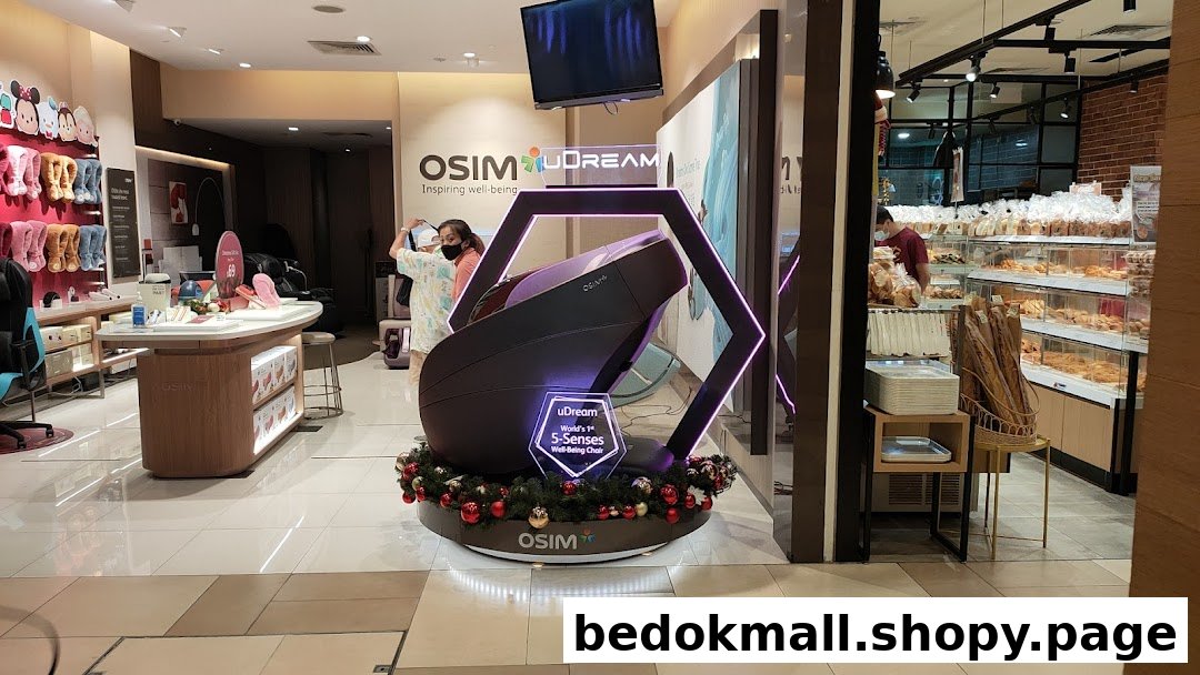 Interior view of an OSIM store with a large massage chair display.