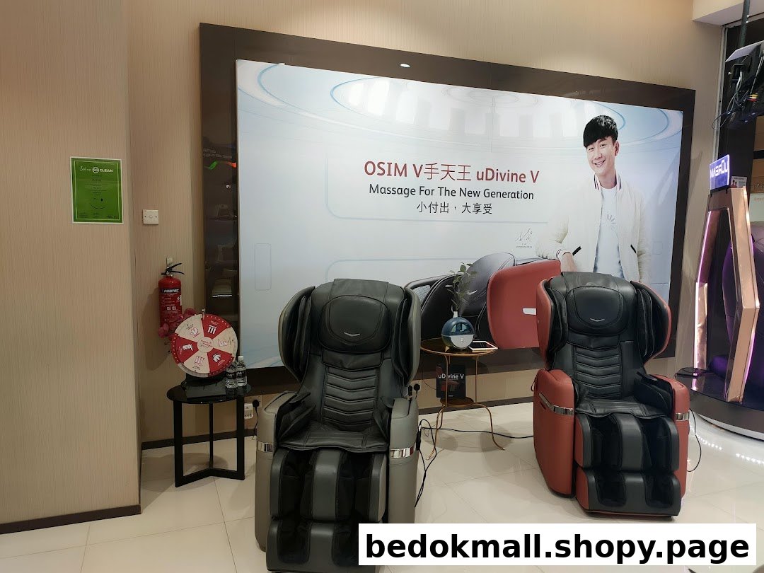 Interior view of OSIM shop displaying massage chairs and promotional backdrop.
