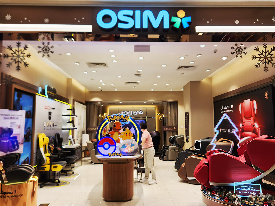 Interior view of an OSIM store displaying massage chairs and products.