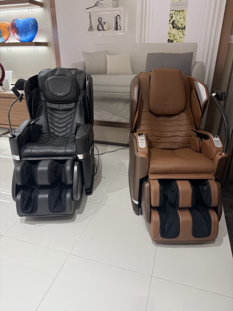 Two massage chairs displayed in a retail showroom.