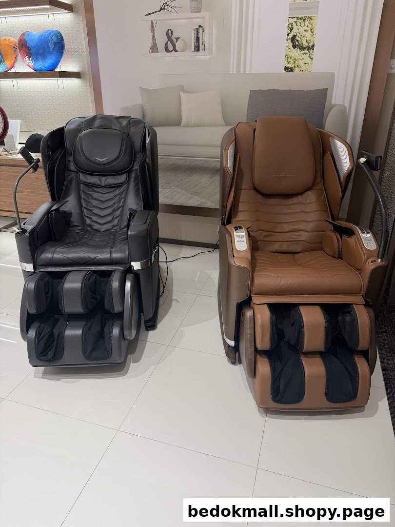 Two massage chairs displayed in a retail showroom.