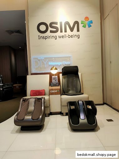Interior view of OSIM store displaying massage chairs and foot massagers.
