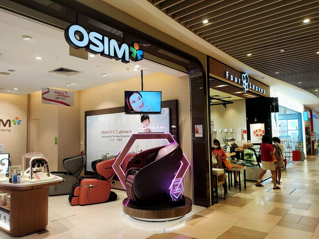 OSIM shop entrance in a mall with massage chairs on display.