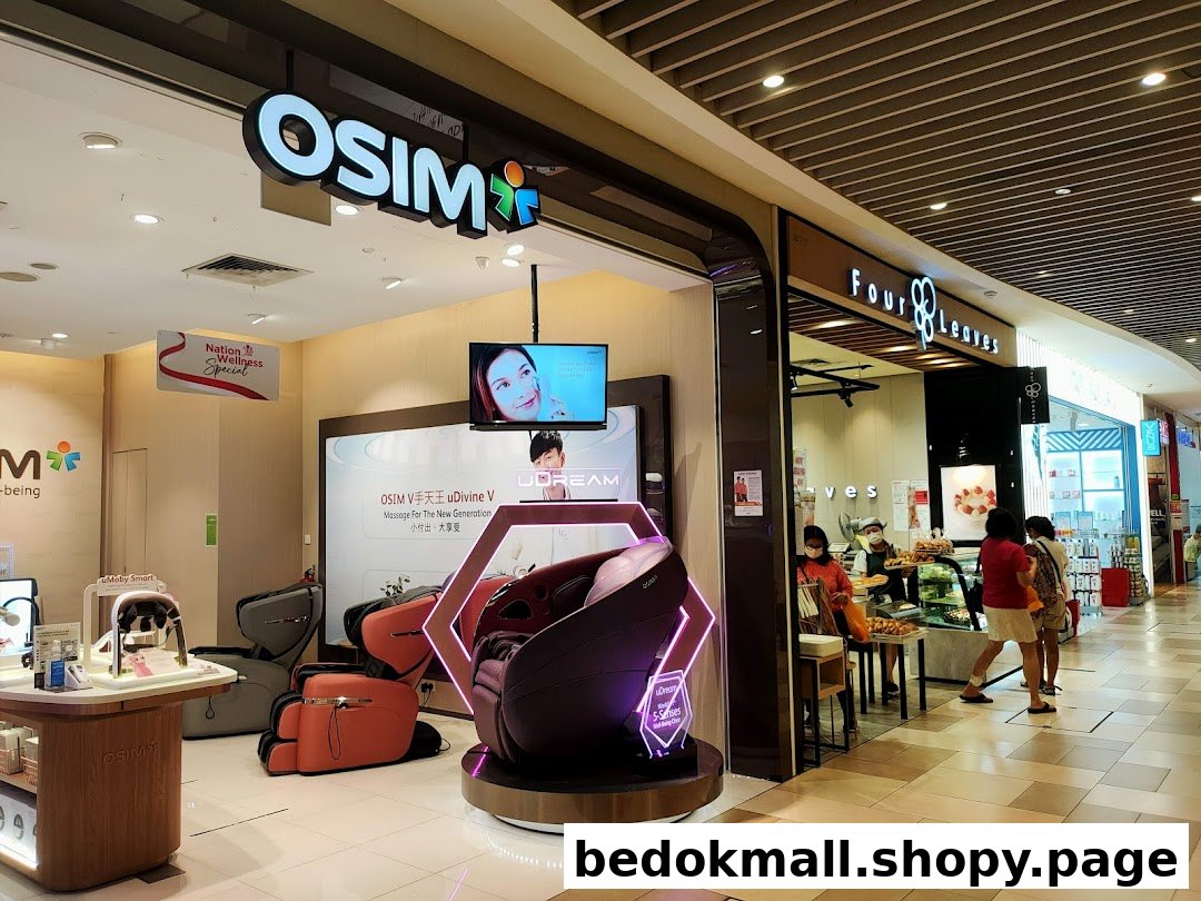 OSIM shop entrance in a mall with massage chairs on display.