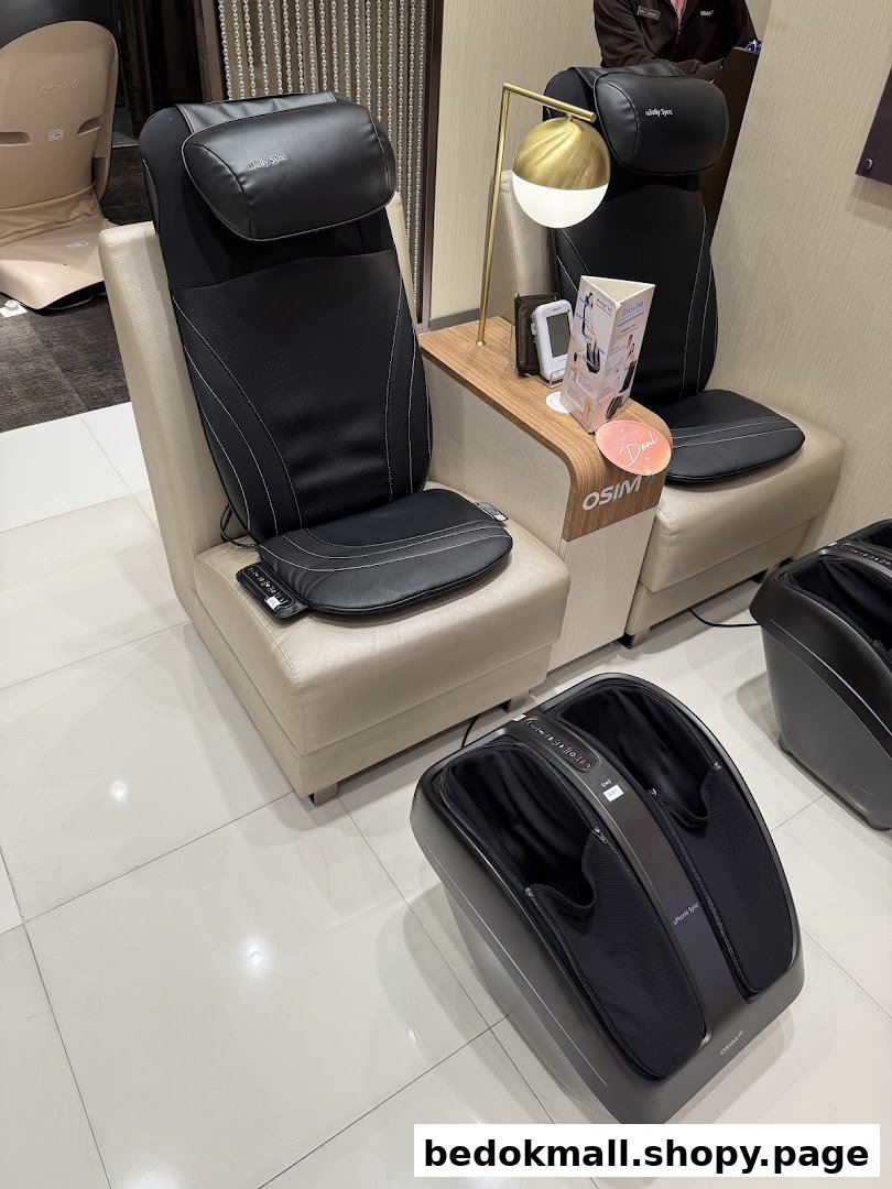 Massage chairs and a foot massager displayed in a shop interior.