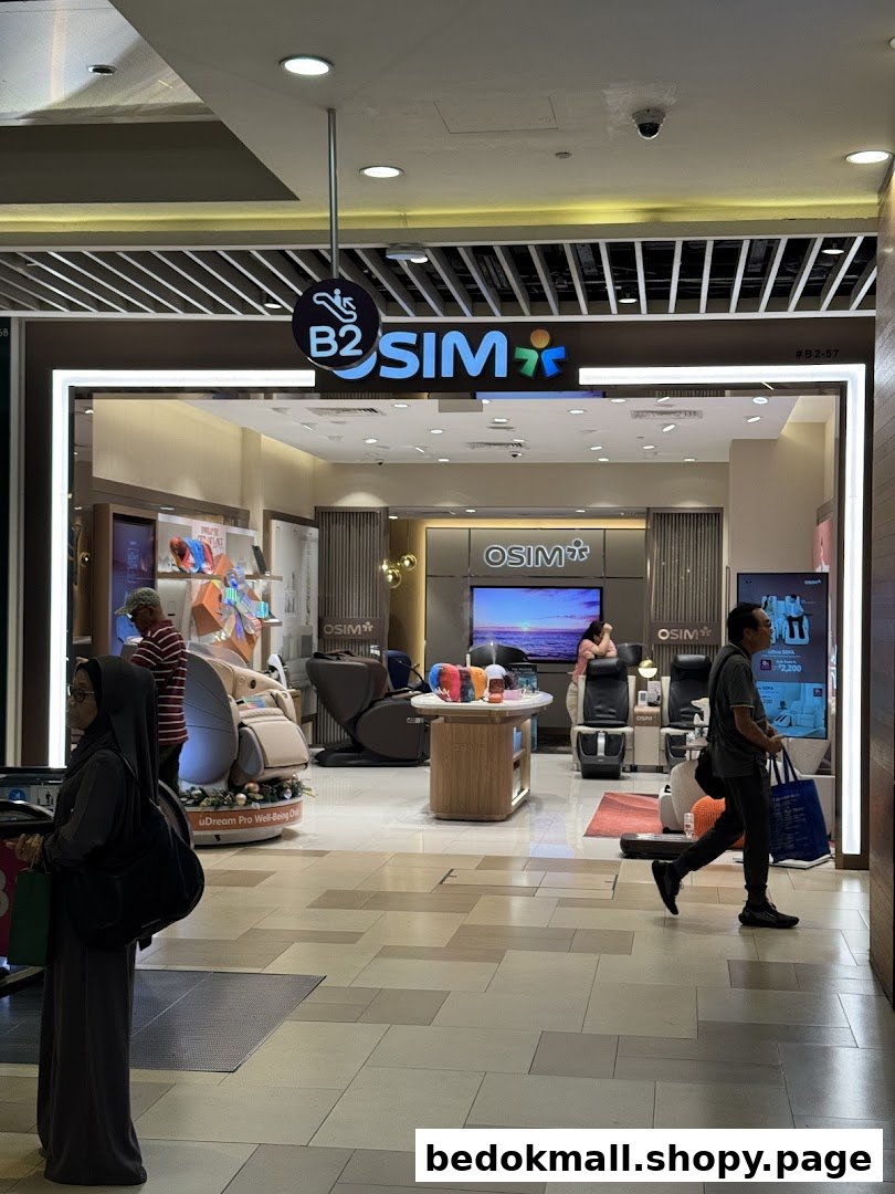OSIM shop entrance from mall corridor, showing interior and customers.