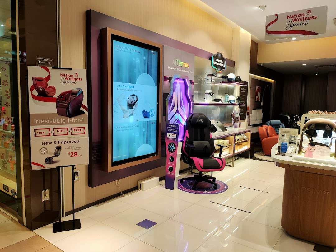 Interior view of an OSIM store displaying massage chairs and wellness products.