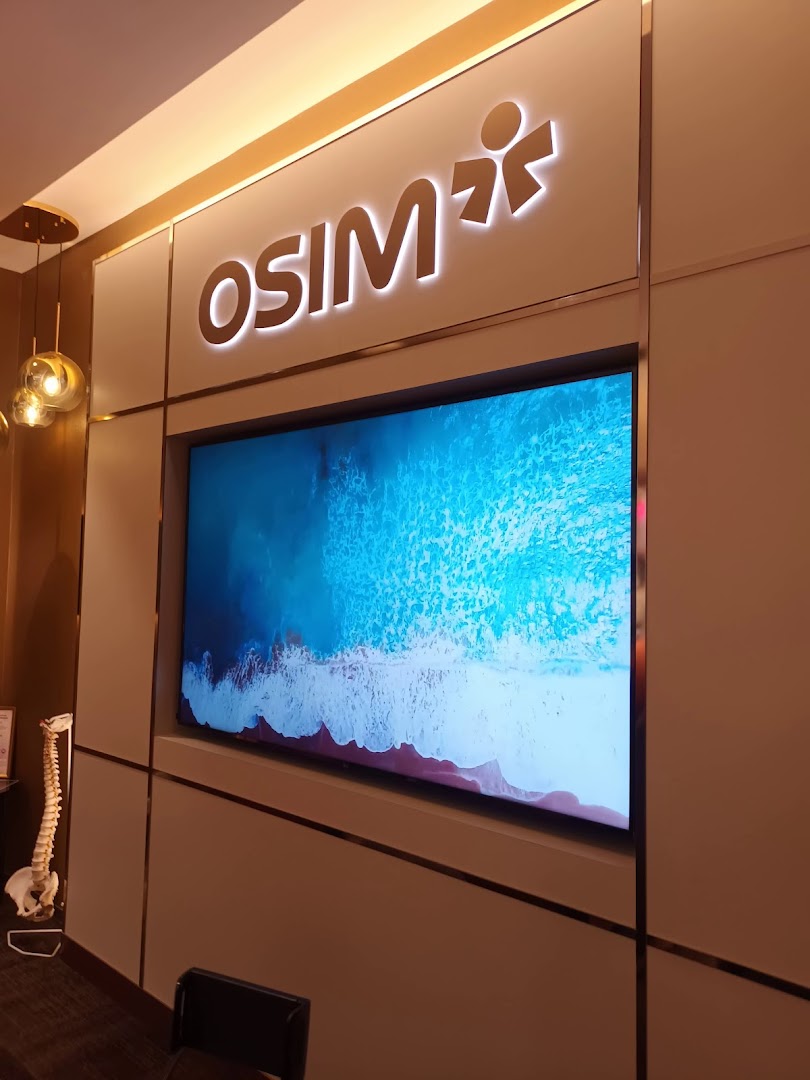 Interior view of OSIM shop with logo and large screen display.