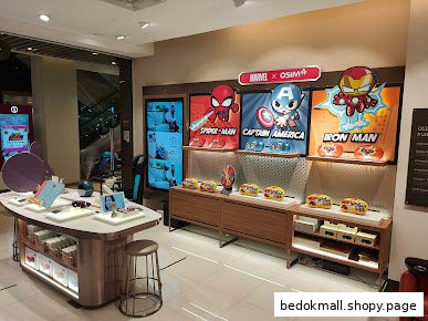 Shop interior with display tables and Marvel x OSIM promotional products.