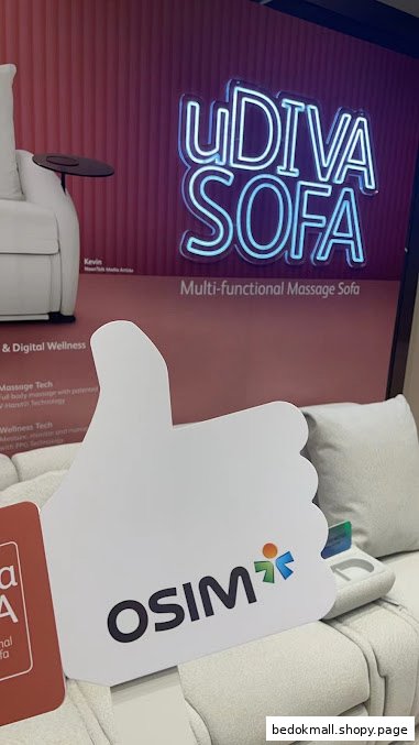 Interior shot of an OSIM store displaying a massage sofa and promotional sign.