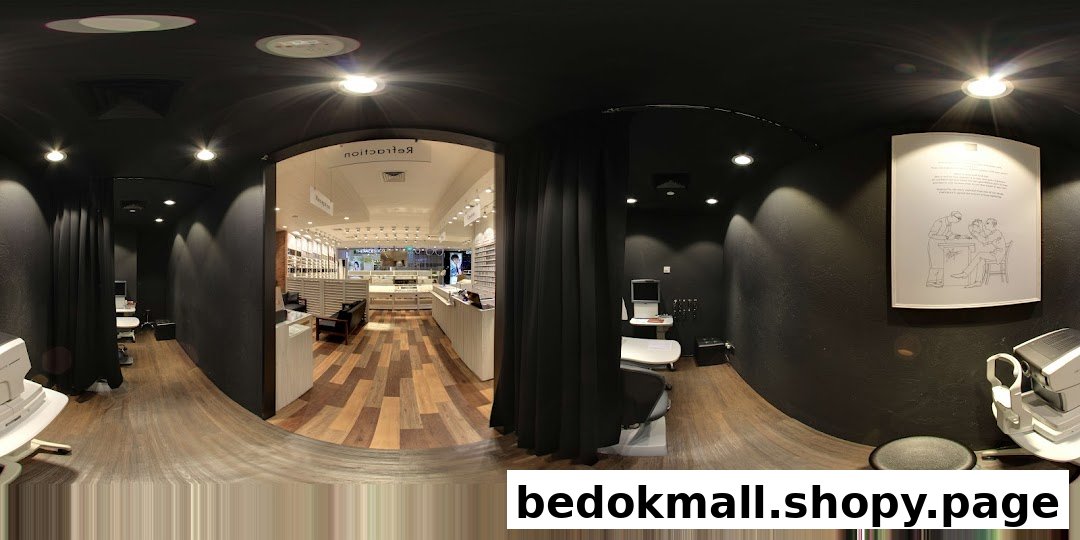 Interior view of an optical shop with display cases and examination areas.