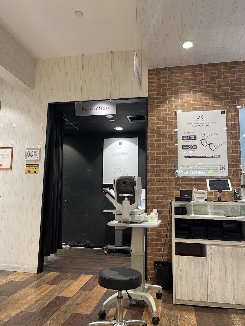 Shop interior showing an eye refraction room and optical equipment.