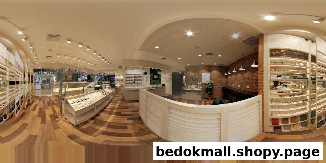 Panoramic interior view of a modern eyewear shop with display shelves and counter.