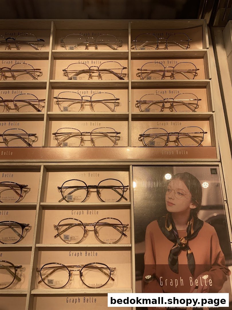 Eyeglasses displayed on shelves with a promotional poster in a retail shop.