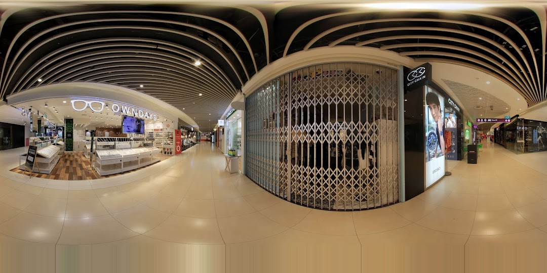 Front of OWNDAYS shop with display cases in a mall corridor.