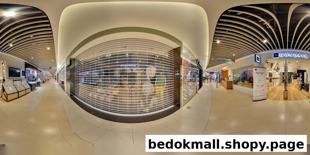 OWNDAYS shop entrance and interior seen from a mall corridor.