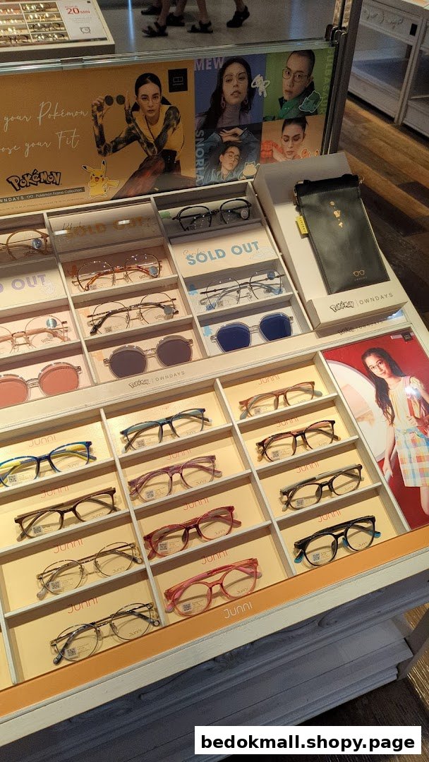 Display of various eyeglasses and promotional posters inside a shop.