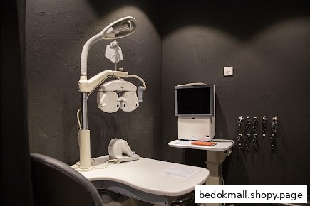 Interior shot of an eye examination room with optical equipment.