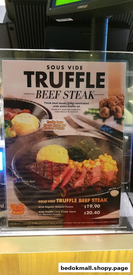 A menu display for sous vide truffle beef steak with prices.