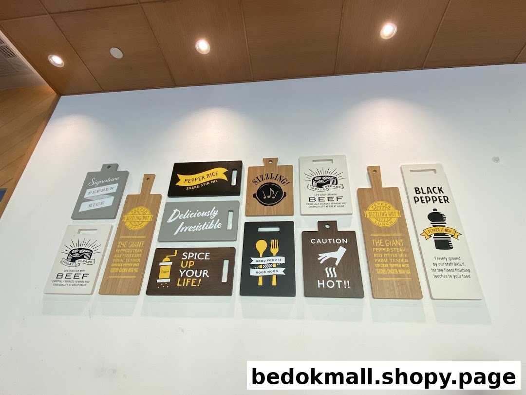 Decorative wall signs with food names and branding messages inside a shop.