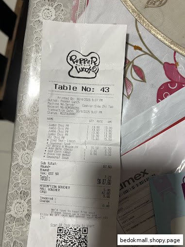 Close-up of a paper receipt from Pepper Lunch showing purchased items and total.