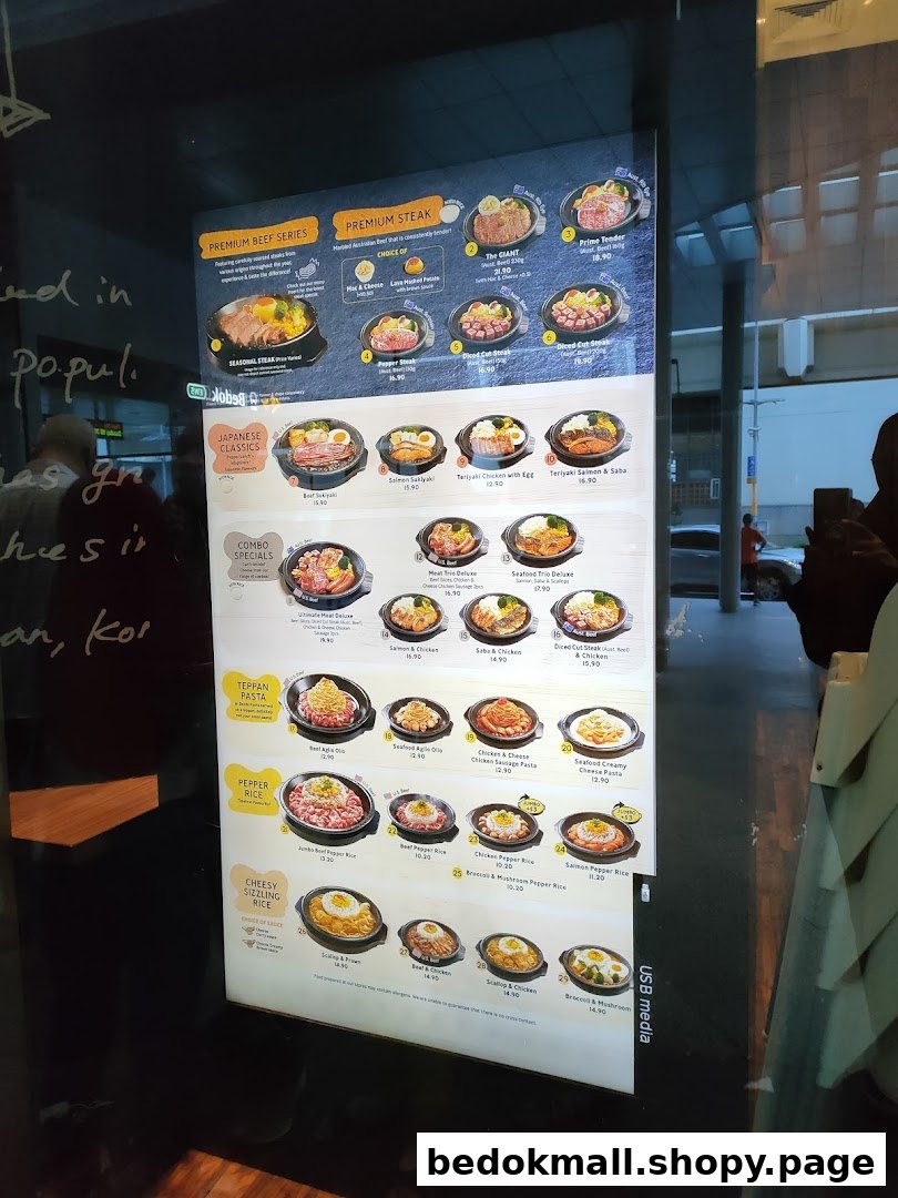 A digital menu board displaying various food items and prices.