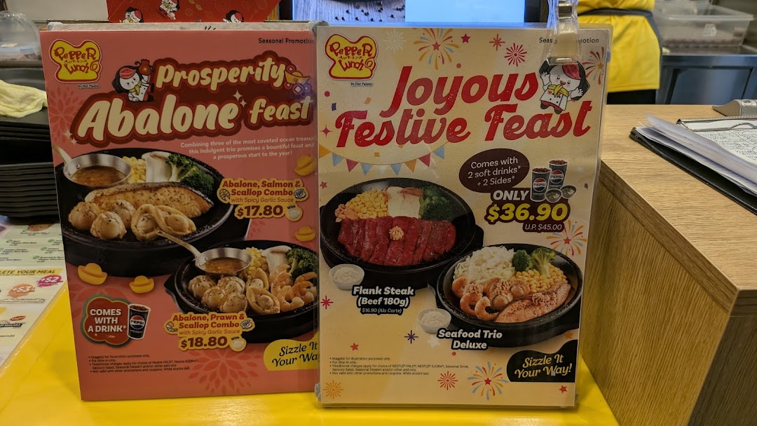 Two large menu boards displaying various food items and prices.