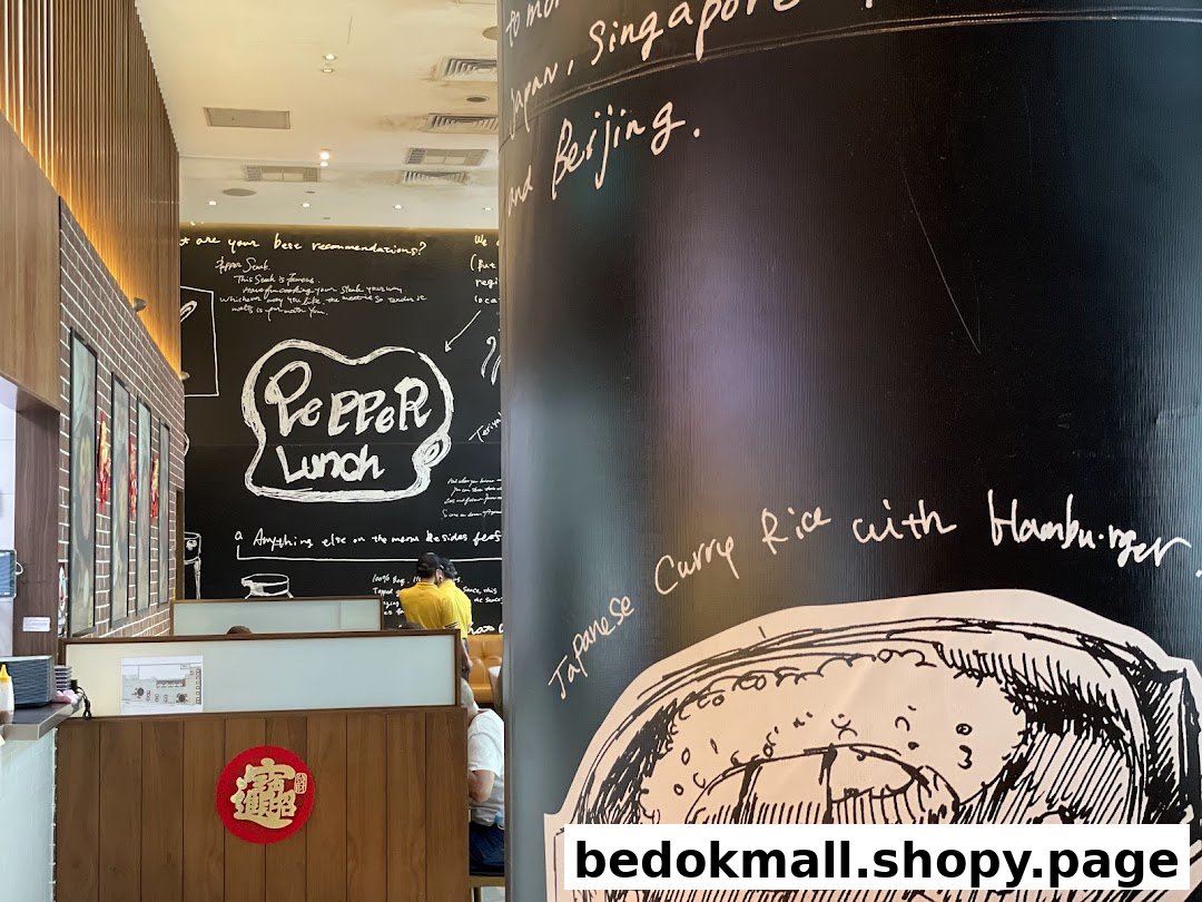 Interior view of Pepper Lunch restaurant with decorated walls and dining area.