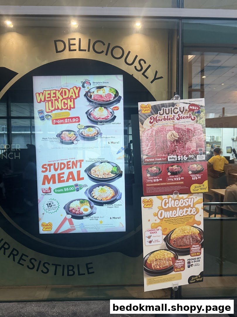 Various food menus and promotional offers displayed on a shop window.