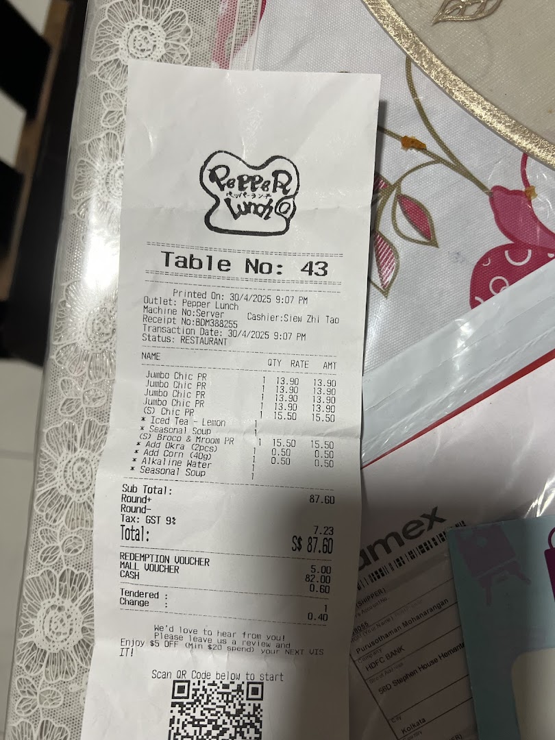 A close-up of a printed restaurant receipt from Pepper Lunch.