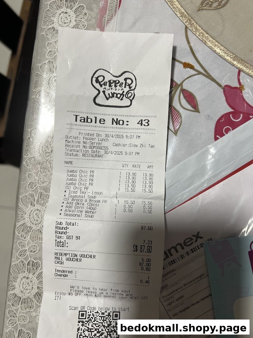 A close-up of a printed restaurant receipt from Pepper Lunch.