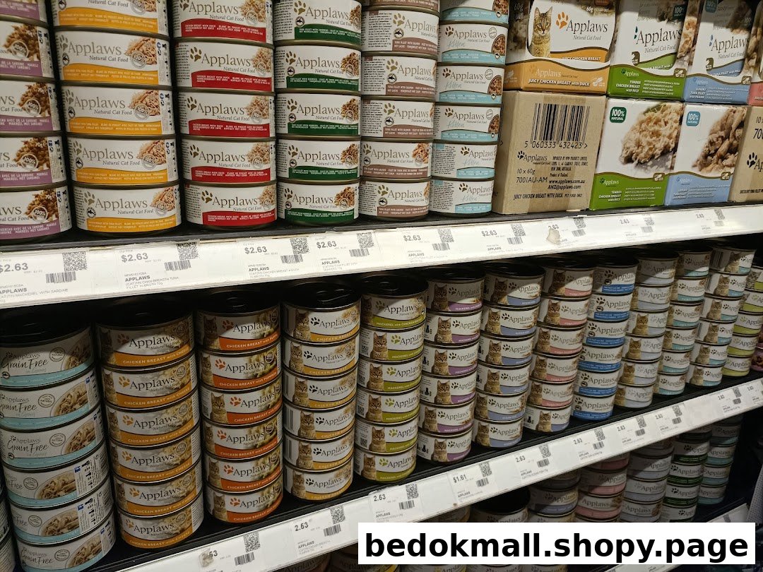 Shelves filled with various brands and types of canned pet food.