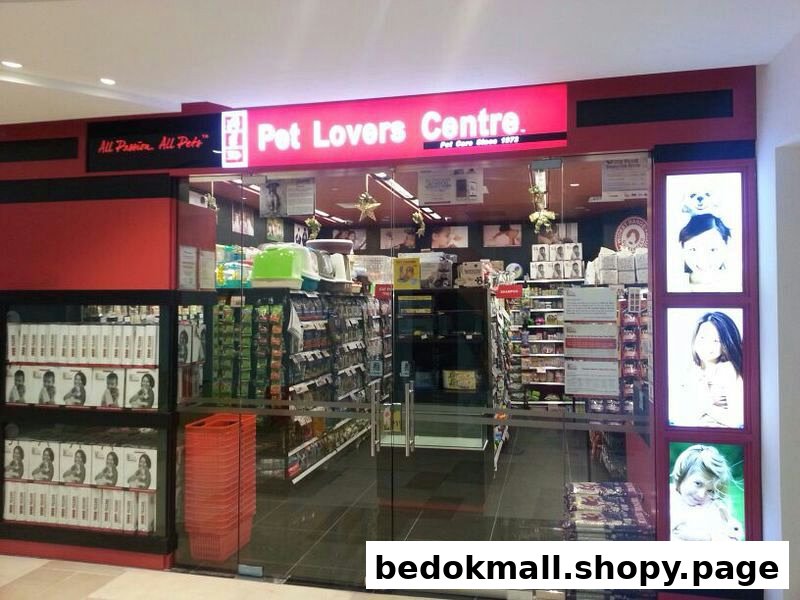 Exterior view of Pet Lovers Centre with red signage and glass entrance.