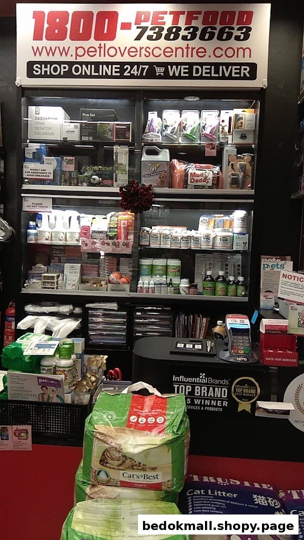 Interior view of a pet shop showing products on display and a counter.