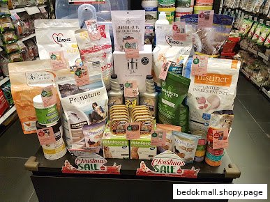 A display of various pet food products inside a retail store.