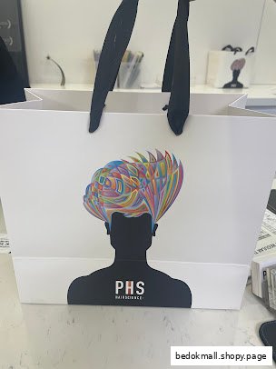 White shopping bag with colorful head graphic and PHS HAIRSCIENCE logo.