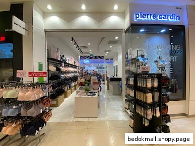 Entrance of a Pierre Cardin lingerie shop with products displayed.