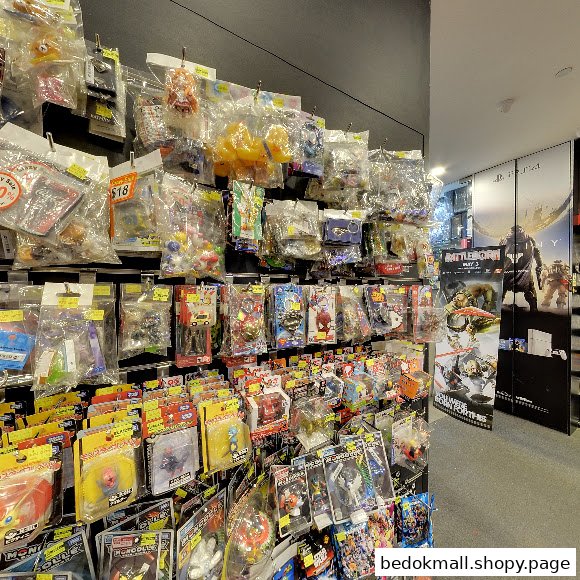 Shelves filled with packaged toys and collectibles inside a retail shop.