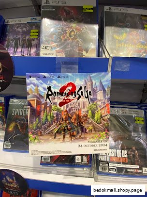 Shelves displaying video games and a promotional poster in a retail store.